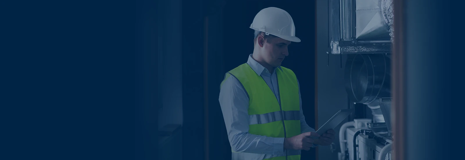 background image of HVAC specialist holding a tablet