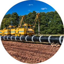 Oil pipeline being installed by heavy machinery