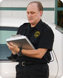 Cop taking notes on clipboard